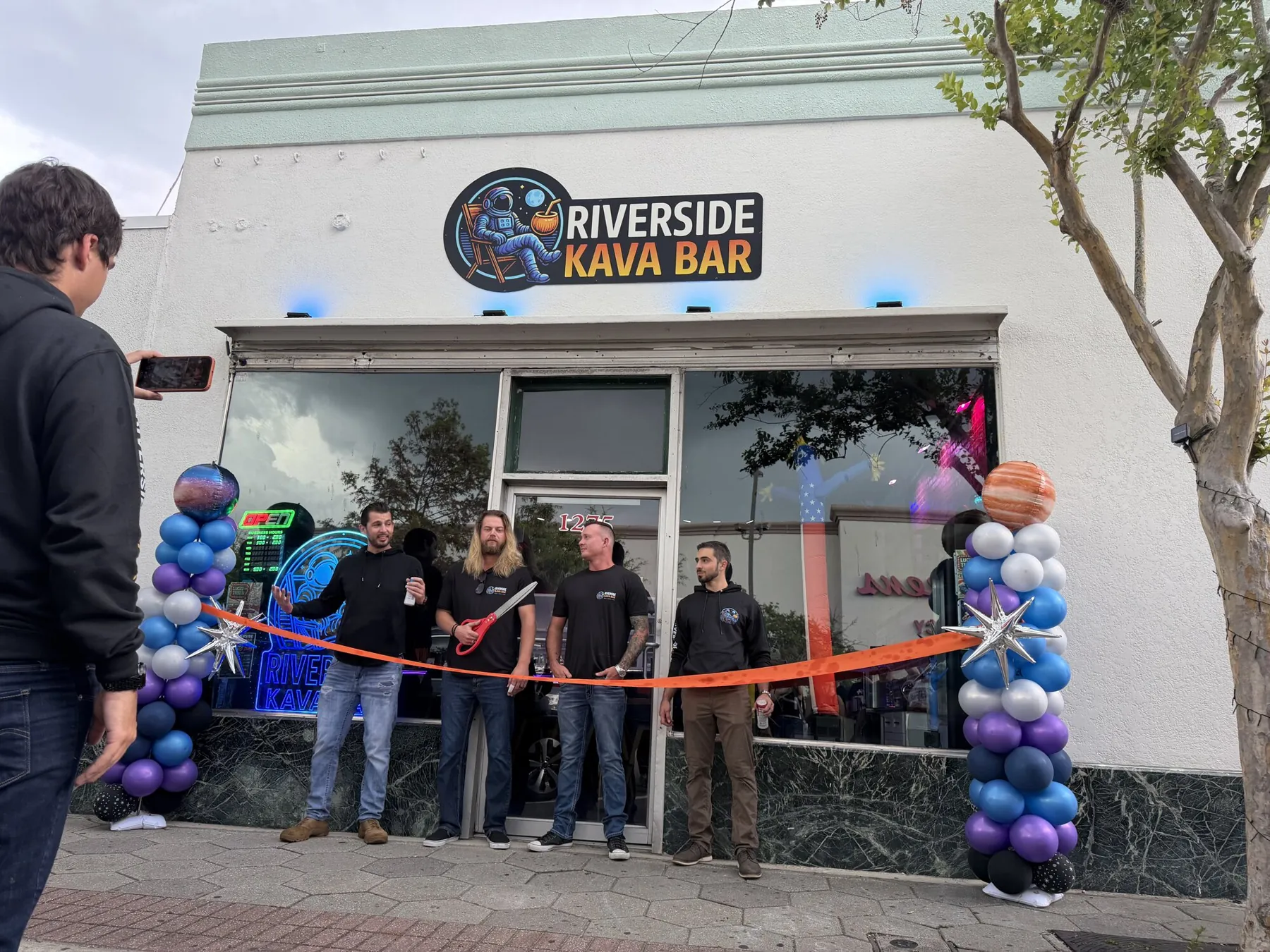 Ribbon cutting at the Riverside Kava Bar grand opening, July 2026